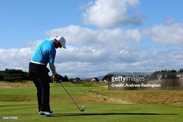 Marc Warren of Scotland hits his tee-shot on the 14th hole during the final round of the Johnnie Walker Championship on the PGA Centenary Course at...