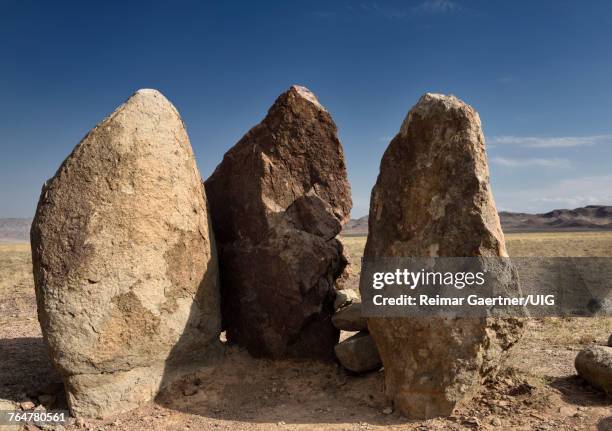 three standing stones in altyn emel park called oshak tas a burial mound or fire pit of genghis khan - kazakhstan steppe stock pictures, royalty-free photos & images