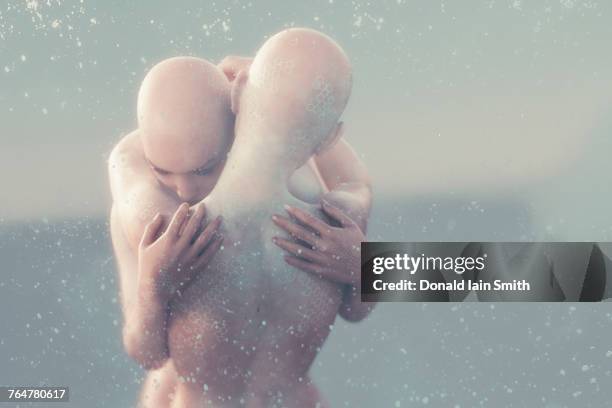 bubbles floating near futuristic hugging woman - cyborg foto e immagini stock