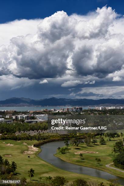clouds over nicklaus design golf course at nuevo vallarta mexico - nuevo vallarta stock pictures, royalty-free photos & images