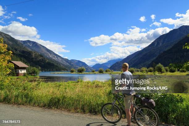 biker, stehekin, chelan county, washington - lake chelan stock pictures, royalty-free photos & images