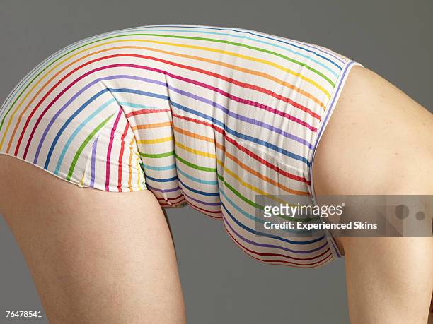 håndvask Gå igennem spin A Woman In Striped Swimsuit Bending Forward High-Res Stock Photo - Getty  Images
