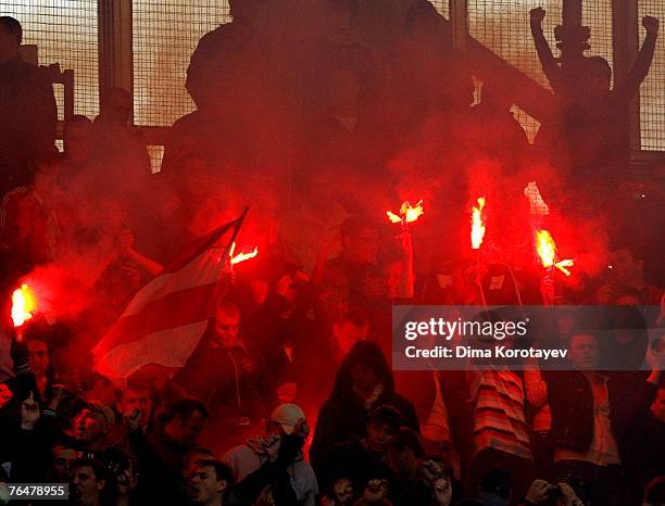 Fans light flares during the Russian Football League Championship match between Spartak and CSKA on September 02, 2007 in Moscow, Russia.