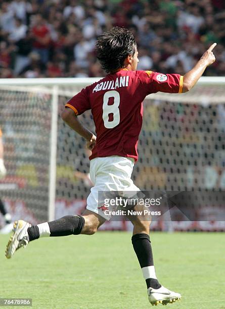 Alberto Aquilani celebrates scoring the first goal for Roma during a Serie A match between Roma and Siena at the Stadio Olimpico on September 02,...