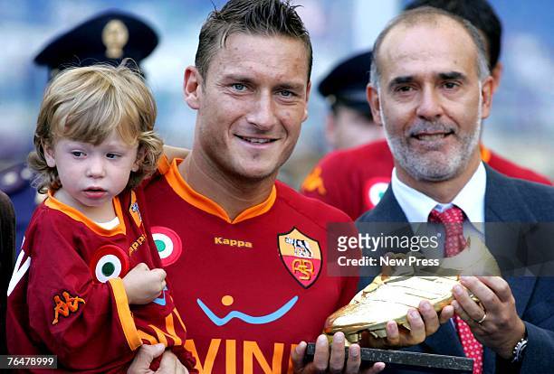Francesco Totti of Roma holding his son Cristian as he receives the 'Golden Shoe 2007' award as best player of the Italian premier league during a...