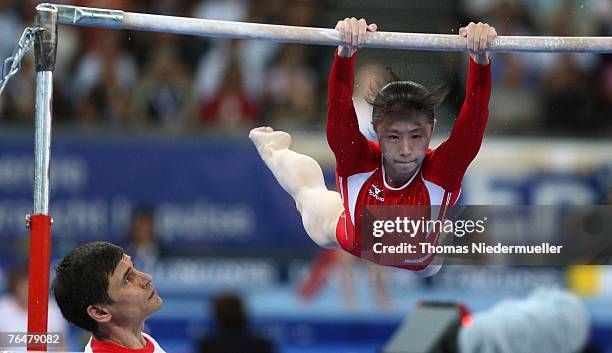 Keiko Mukumoto of Japan performs on the uneven bars during the women's qualifications of the 40th World Artistic Gymnastics Championships on...