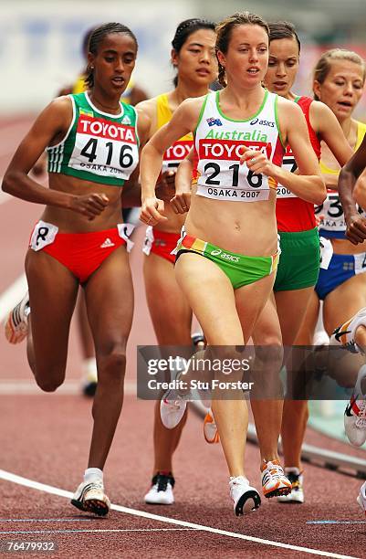 Mestawat Tadesse of Ethiopia and Lisa Corrigan of Australia compete during the Women's 1500m Heats on day five of the 11th IAAF World Athletics...