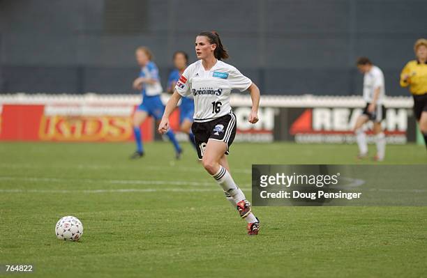Christine McCann of the Boston Breakers looks to move the ball upfield during the WUSA game against the Washington Freedom on June 12, 2002 at RFK...