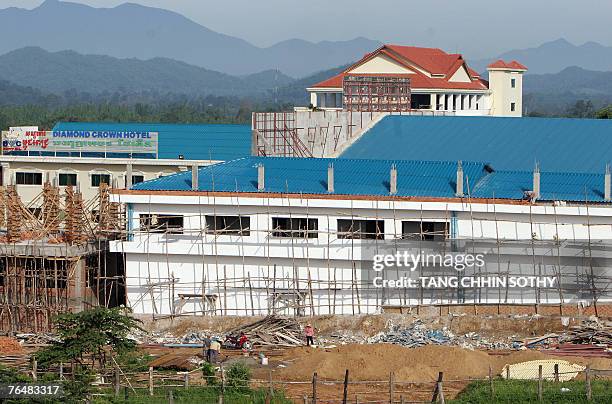 Cambodia-KRouge-economy-gambling-tourism,FEATURE" by Suy Se A new building under construction in the former Khmer Rouge's stronghold Pailin, near the...