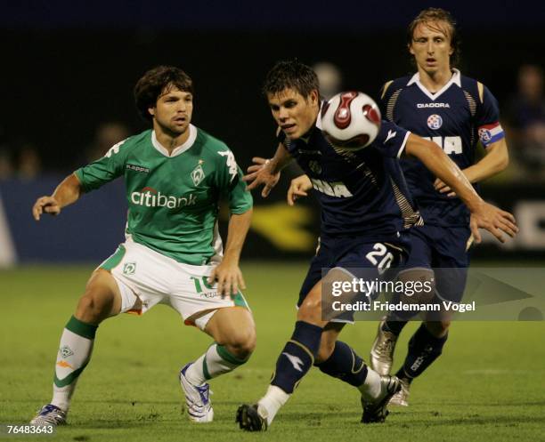 Diego of Werder fights for the ball with Ognjen Vukojevic and Luka Modric of Zagreb during the Champions League third qualifying round, second leg...