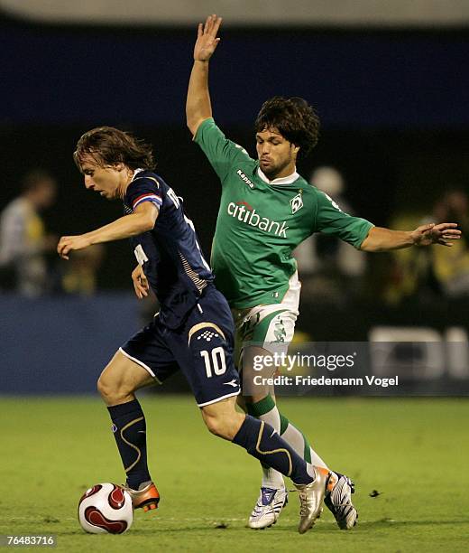 Diego of Werder fights for the ball with Luka Modric of Zagreb during the Champions League third qualifying round, second leg match between Dinamo...