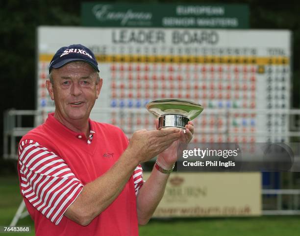 Carl Mason of England poses with the trophy after the final round of the European Senior Masters played over the Duke's Course on September 2, 2007...