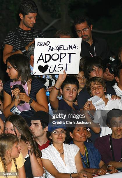 Fans hold a sign at The Assassination Of Jesse James By The Coward Robert Ford premiere in Venice during day 5 of the 64th Venice Film Festival on...