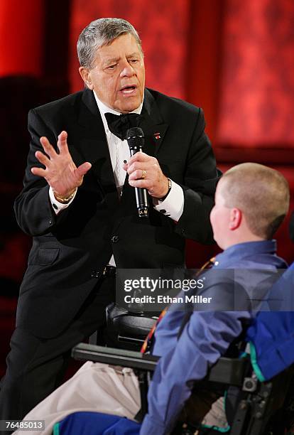 Entertainer Jerry Lewis speaks with Muscular Dystrophy Association goodwill ambassador Luke Christie during the 42nd annual Labor Day Telethon to...