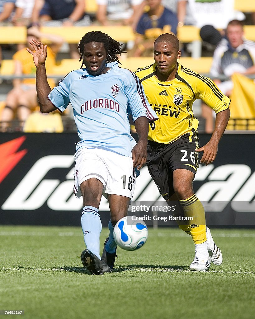 Andy Herron of the Columbus Crew pursues Ugo Ihemelu of the Colorado