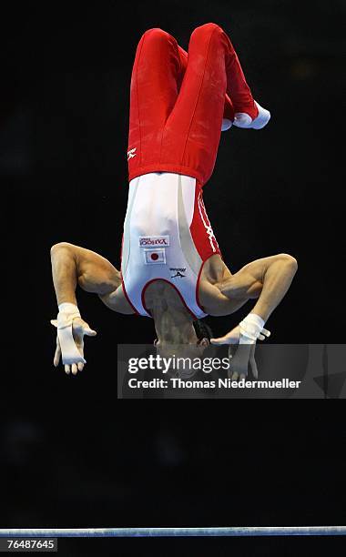 Hisashi Muzitori of Japan performs on the horizontal bar during the men's qualifications of the 40th World Artistic Gymnastics Championships on...