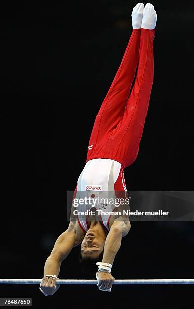 Hisashi Muzitori of Japan performs on the horizontal bar during the men's qualifications of the 40th World Artistic Gymnastics Championships on...