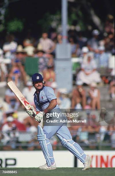 English batsman Allan Lamb makes a run during a match against the West Indies in the Benson & Hedges World Series at Brisbane, Australia, 1987.