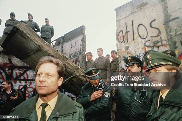 West German Police securing the area around the first section of the Berlin Wall to be torn down by crowds on the morning of 10th November 1989...