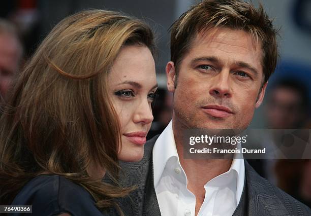 Actors Brad Pitt and his wife Angelina Jolie arrive for the premiere of "The Assassination of Jesse James by the Coward Robert Ford" during the 33rd...