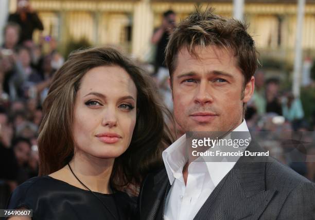 Actors Brad Pitt and his wife Angelina Jolie arrive for the premiere of "The Assassination of Jesse James by the Coward Robert Ford" during the 33rd...