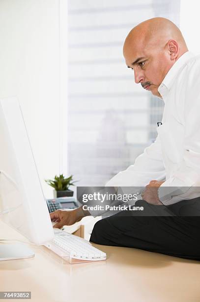 businessman using computer - hairless mouse stock pictures, royalty-free photos & images