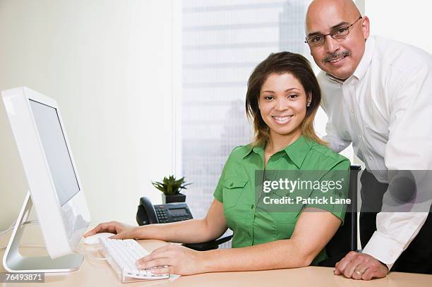 co-workers using computer - hairless mouse stock pictures, royalty-free photos & images