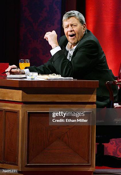 Entertainer Jerry Lewis laughs while watching a performer during the 42nd annual Labor Day Telethon to benefit the Muscular Dystrophy Association at...