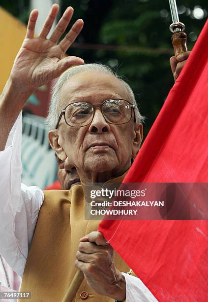 Veteran leader of the Communist Party of India Jyoti Basu waves as he flags off a 'Jatha' in Kolkata, 04 September 2007, against a massive joint...