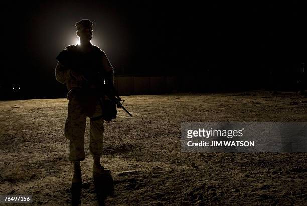 Marine stands guard as US President George W. Bush visits Al-Asad Air Base in Anbar Province, Iraq, 03 September 2007. Bush said during a surprise...