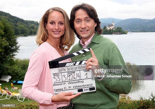German actress Lara Joy Koerner and Austrian actor Ulrich Reinthaller pose during a photocall for the TV series "Der Arzt vom Woerthersee" on...