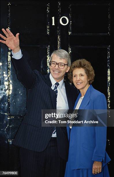 New British Prime Minister John Major poses outside Number 10, Downing Street with his wife Norma, 1990.