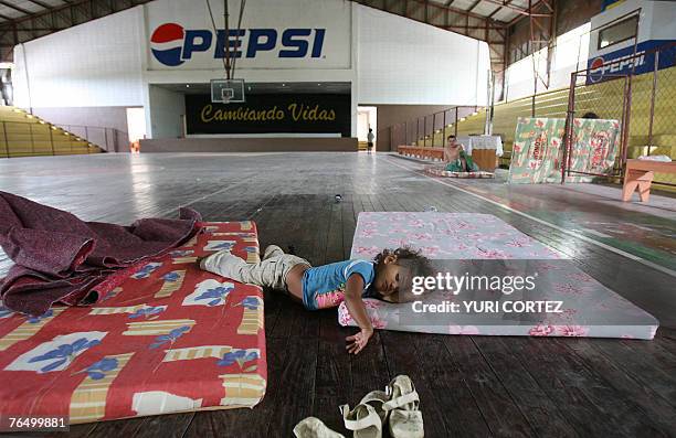 Girls sleeps in a temporary shelter in Azcona Gym at the city port of La Ceiba, Honduras as hurricane Felix approaches 04 September 2007. Hurricane...
