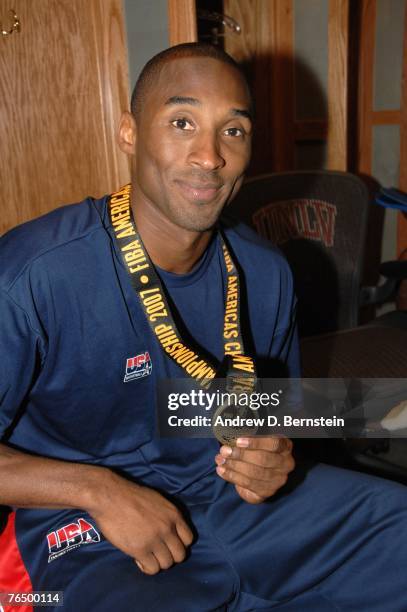 Kobe Bryant of the USA Men's Senior National Team shows off his medal after the medal ceremony after defeating Argentina during the gold medal game...