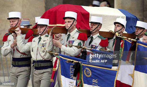 Members of the French foreign legion carry the coffin of former French prime minister Pierre Messmer, during his funeral ceremony at the Hotel des...