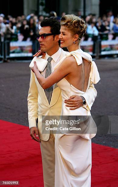 Joe Wright, the director, with actress Rosamund Pike, arrives at the UK premiere of the film 'Atonement' at the Odeon in Leicester Square on...