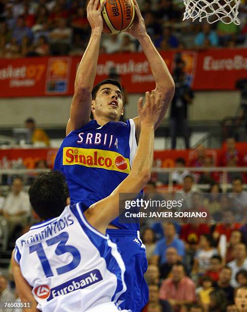 Serbia's Zoran Erceg shoots against Greece's Dimitrios Diamantidis during a preliminary round Group A match of the European Basketball Championships...