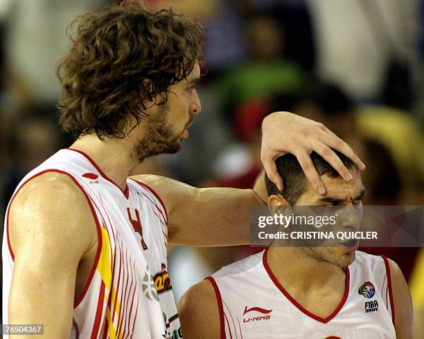 Spain's Jose Calderon celebrates after shooting a basket with Pau Gasol during a preliminary round match of the European basketball championships at...