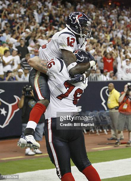 Wide receiver Jacoby Jones of the Houston Texans celebrates with teammate Steve McKinney during a preseason game against the Dallas Cowboys at...