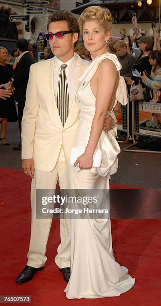 Joe Wright, the director, with actress Rosamund Pike, arriving at the UK premiere of the film 'Atonement' at the Odeon in Leicester Square on...