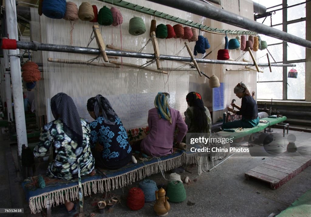 Uigur Women Weave Carpets In Hetian Carpet Factory