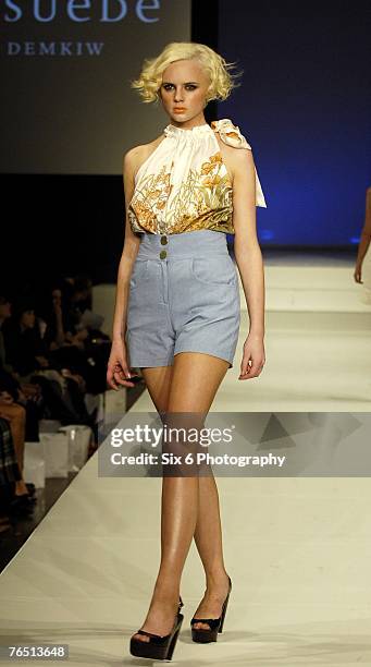 Model showcases designs on the catwalk at the Hot in the City evening parade, featuring designs by Bettina Liano, Clemente Talarico, Flamingo Sands,...