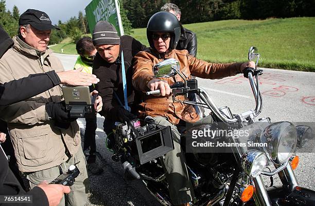 German actor Wolfgang Fierek and director Peter Weissflog are seen during the shooting of the TV series "Der Arzt vom Woerthersee" on September 5,...