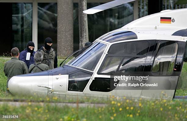 Terror suspect is escorted to a helicopter by German police after a questioning by procecutors at German federal court September 5, 2007 in...