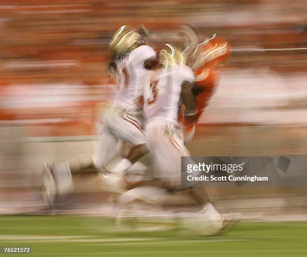 Myron Rolle and Patrick Robinsin of the Florida State Seminoles defend a pass against the Clemson Tigers at Clemson Memorial Stadium on September 3,...