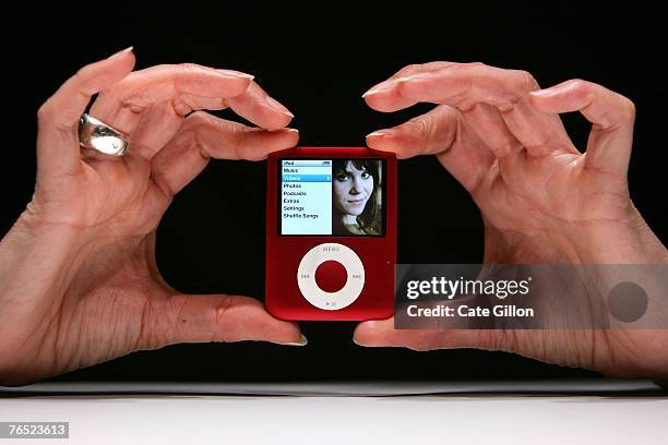 The new Ipod Nano, available in various colours and with a new screen format, is held at the UK launch of the product at the BBC on September 5, 2007...