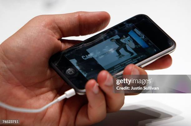 An Apple Special event attendee holds the new iPod Touch September 5, 2007 in San Francisco, California. Jobs announced a new generation of iPods.