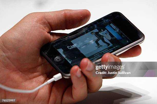 An Apple Special event attendee holds the new iPod Touch September 5, 2007 in San Francisco, California. Jobs announced a new generation of iPods.