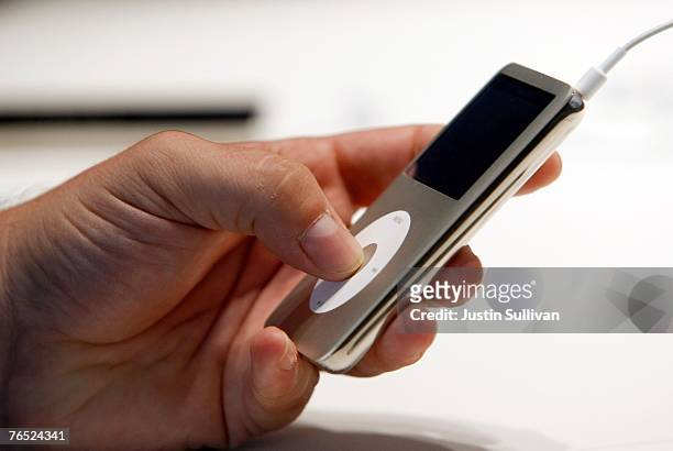 An Apple Special event attendee holds the new iPod Classic September 5, 2007 in San Francisco, California. Jobs announced a new generation of iPods.