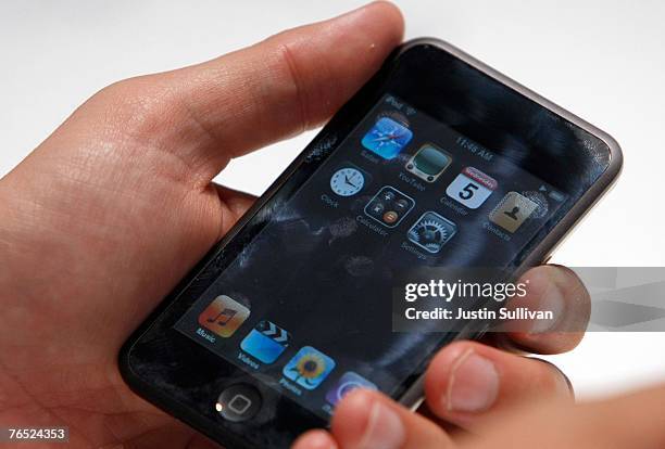 An Apple Special event attendee holds the new iPod Touch September 5, 2007 in San Francisco, California. Apple CEO Steve Jobs announced a new...